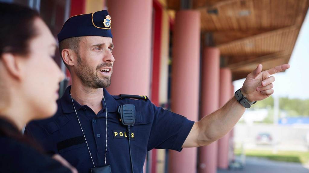 Police officer talking with person