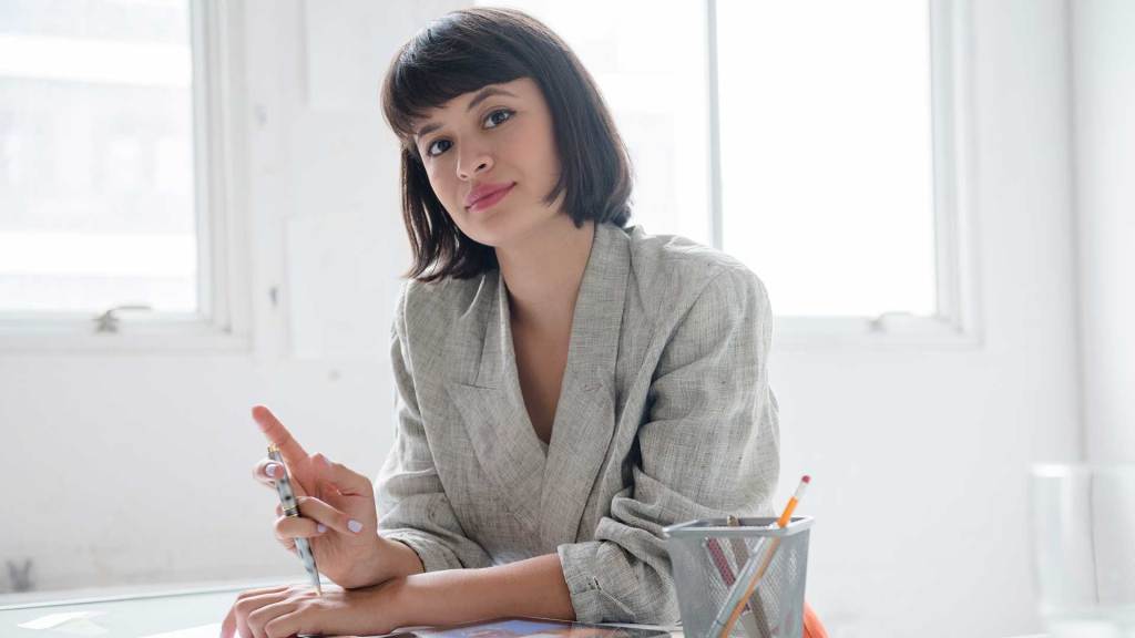 Woman holding pencil