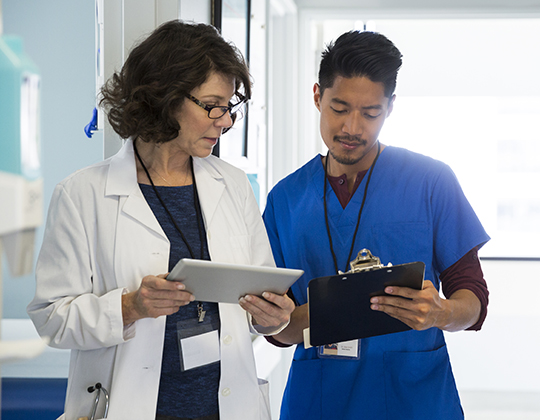 Nurse manager helping staff