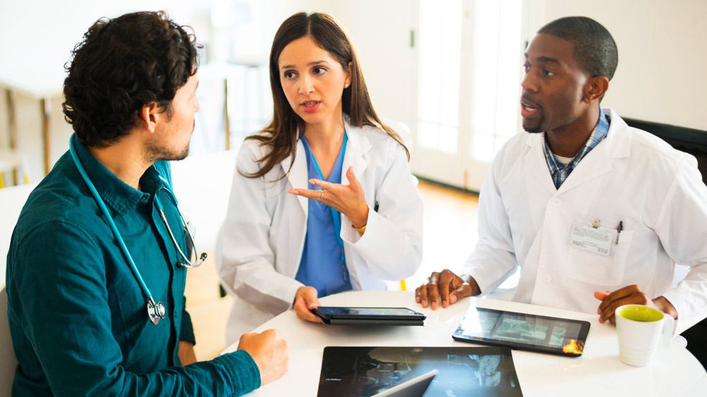 doctors debating in the hallway of hospital