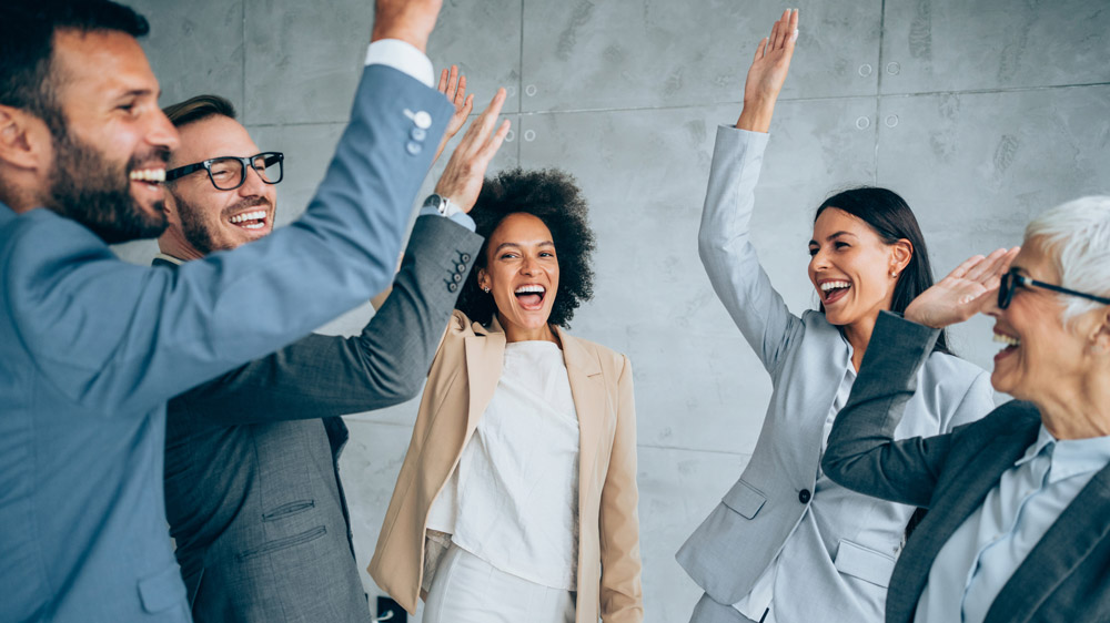 group of business professionals celebrating