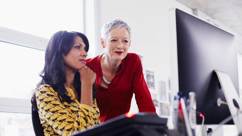 business woman mentoring a younger employee