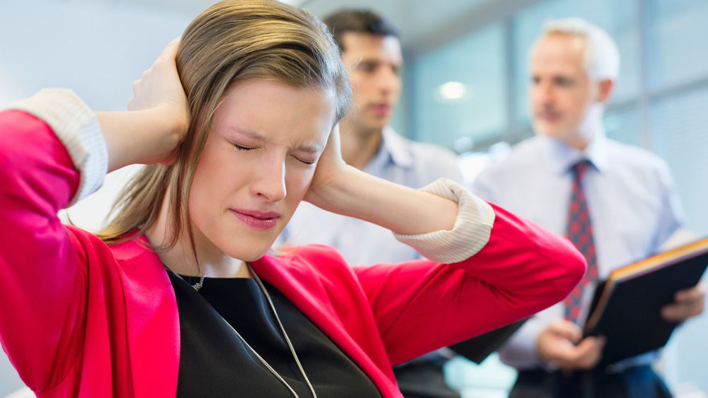 female executive looking frustrated with colleagues