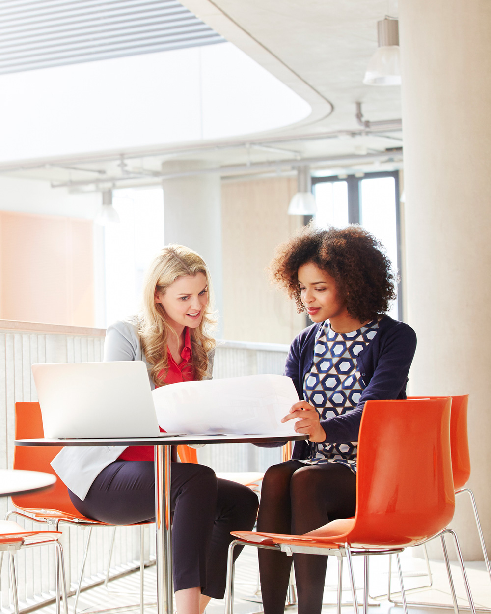 two businesswomen meeting at table