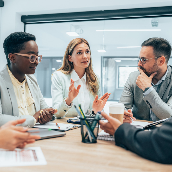 group of people brainstorming at office table