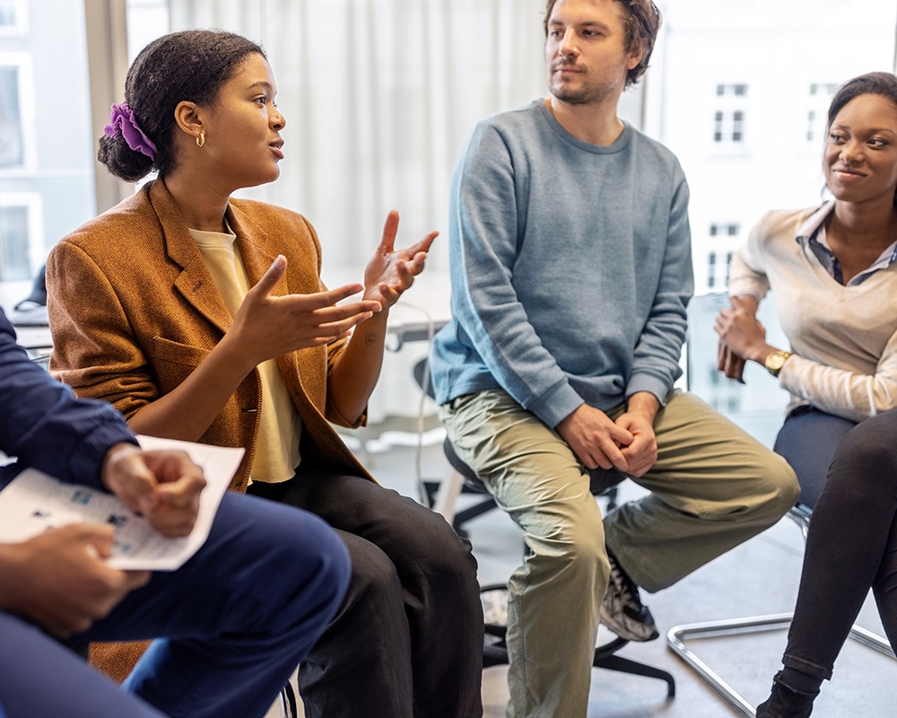 Young woman explaining her ideas during meeting