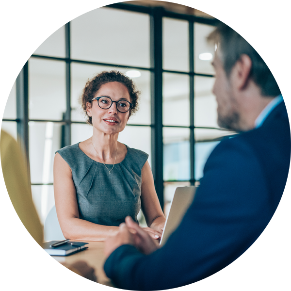 Professional woman speaking with a man